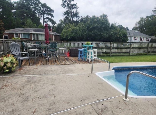 view of pool with a wooden deck