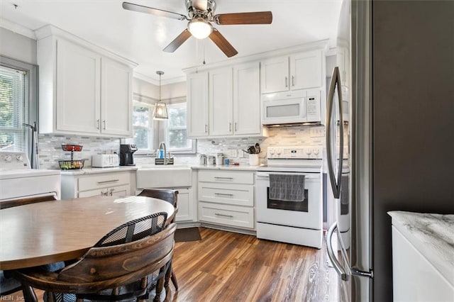 kitchen with white cabinets and white appliances