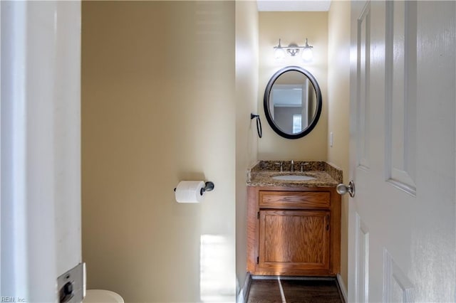 bathroom with vanity and toilet