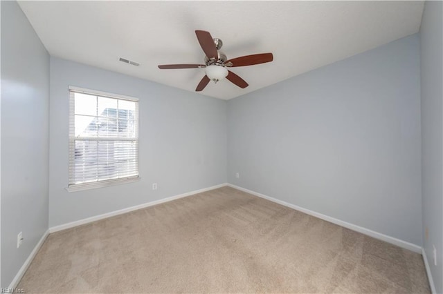 carpeted empty room with ceiling fan