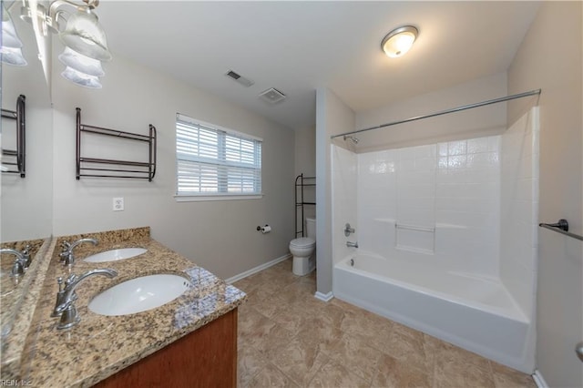 full bathroom with shower / washtub combination, vanity, and toilet