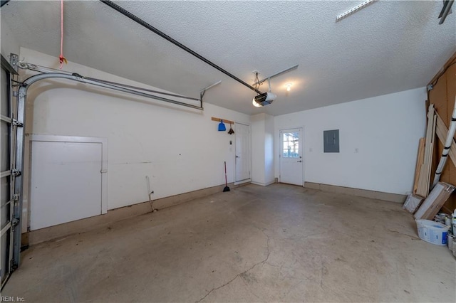 garage with electric panel and a garage door opener