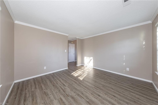 empty room featuring crown molding, dark wood-type flooring, and a textured ceiling