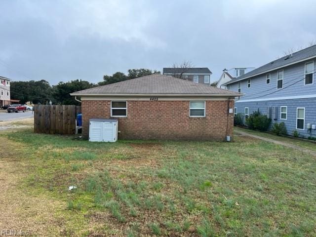 view of side of property featuring a yard