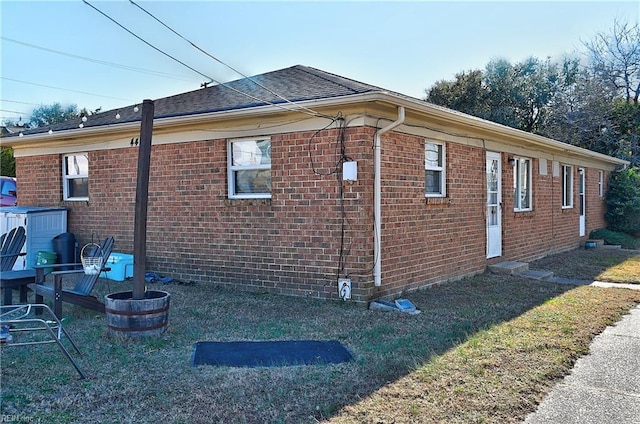 view of home's exterior with a yard