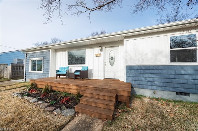 doorway to property with a deck