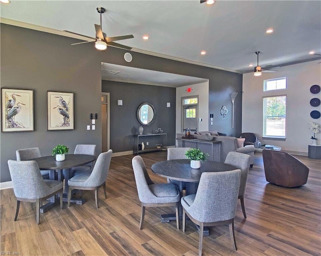 dining space featuring ceiling fan, dark hardwood / wood-style flooring, and ornamental molding