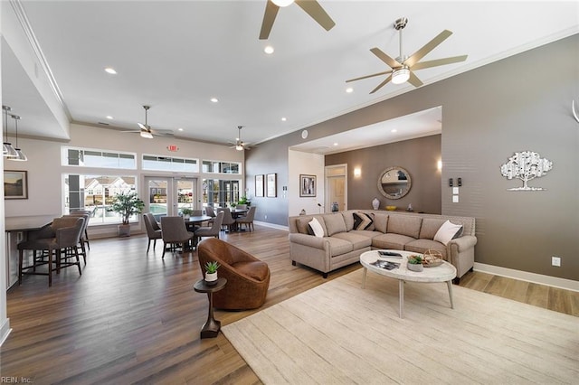 living room featuring hardwood / wood-style floors, french doors, and ornamental molding