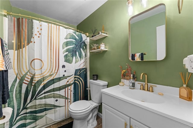 bathroom with curtained shower, vanity, and toilet