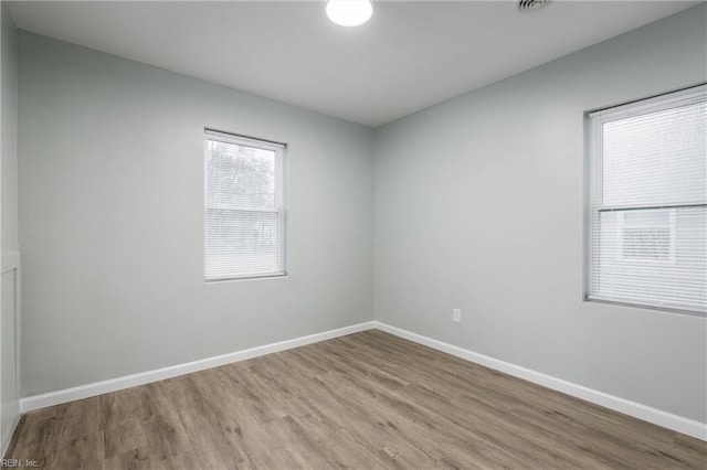 empty room featuring wood-type flooring