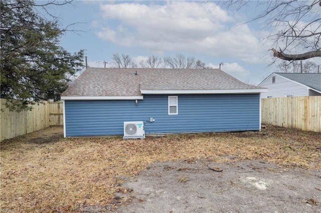 rear view of house with ac unit