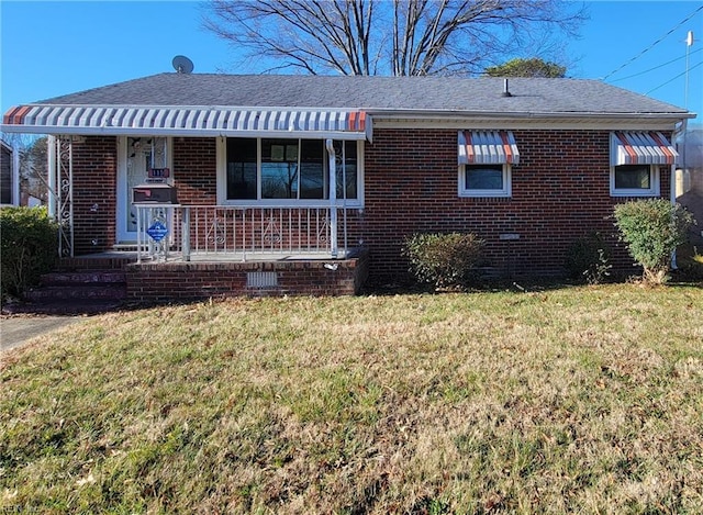 view of front of home featuring covered porch and a front yard