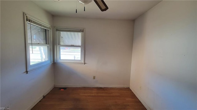 empty room featuring dark hardwood / wood-style floors and ceiling fan