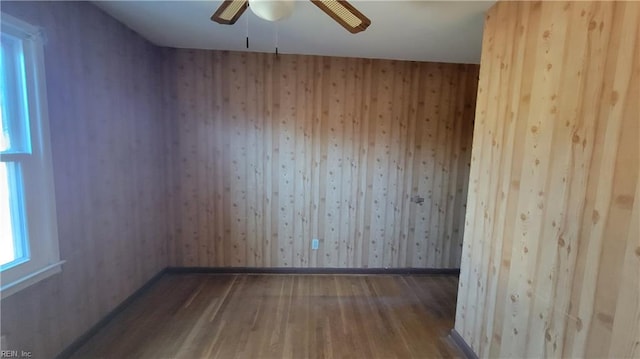 empty room featuring hardwood / wood-style flooring and ceiling fan