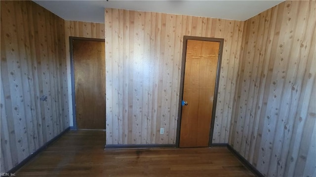 empty room featuring dark wood-type flooring