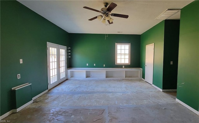 empty room with ceiling fan and french doors