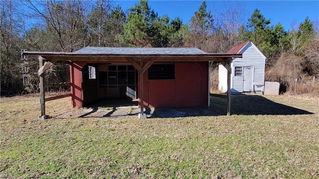 view of outbuilding with a yard