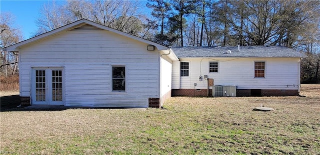 rear view of house with french doors and central AC