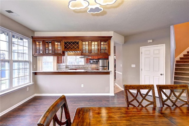 unfurnished dining area with dark hardwood / wood-style floors