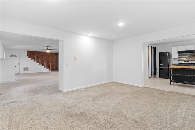 living room featuring ceiling fan and light colored carpet