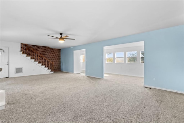 unfurnished living room with carpet flooring and ceiling fan