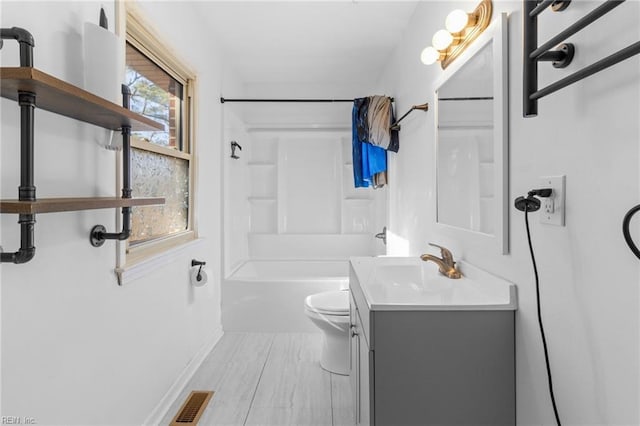 full bathroom featuring vanity, toilet, and tub / shower combination