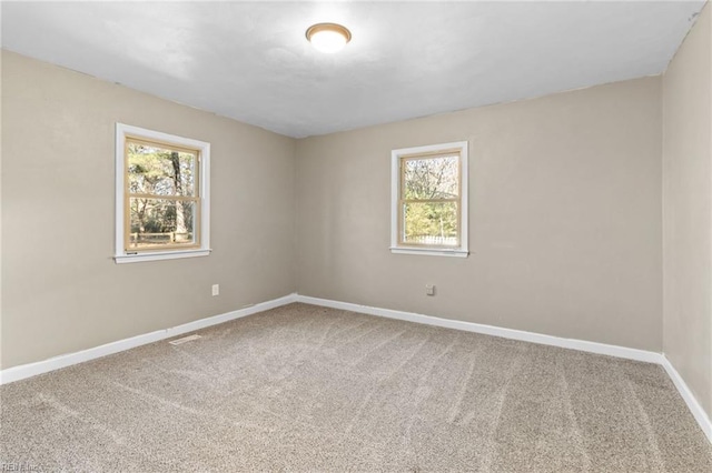 empty room featuring carpet floors