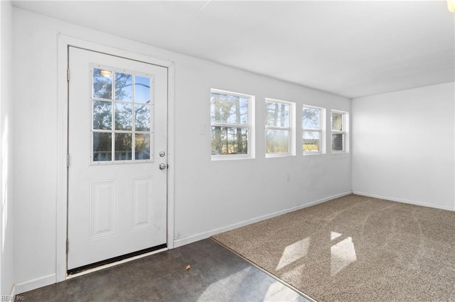 doorway to outside with carpet flooring