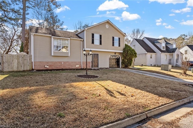 view of front of home featuring a front yard and a garage