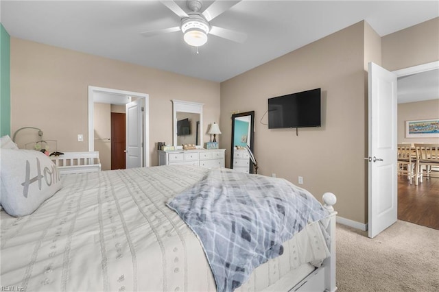 bedroom featuring ceiling fan and light colored carpet