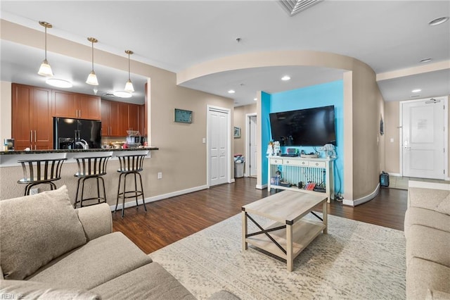 living room featuring dark wood-type flooring