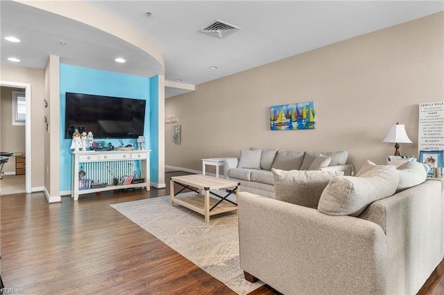 living room featuring dark hardwood / wood-style floors