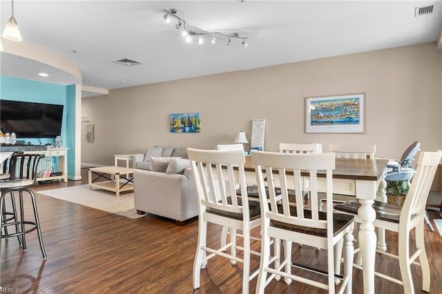 dining room with dark hardwood / wood-style floors