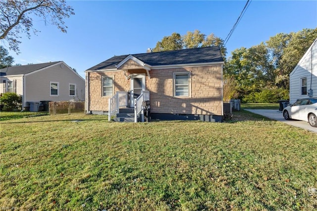 bungalow-style house featuring a front yard