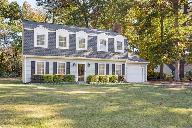 cape cod home featuring a front yard and a garage