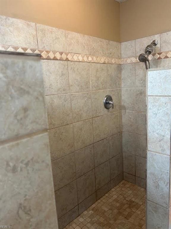 bathroom with tiled shower