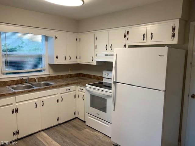 kitchen featuring white appliances, light hardwood / wood-style floors, white cabinetry, and sink