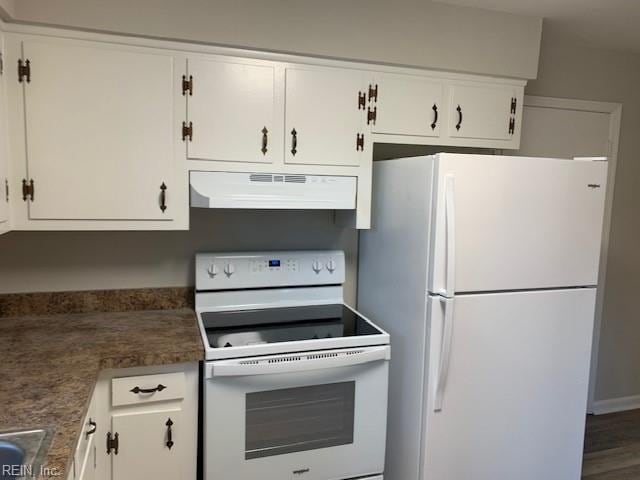 kitchen with white cabinetry, white appliances, and extractor fan