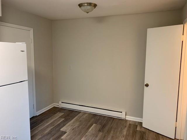 interior space featuring dark hardwood / wood-style flooring and a baseboard radiator