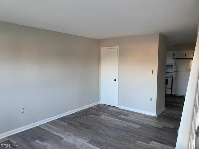 empty room featuring dark hardwood / wood-style flooring