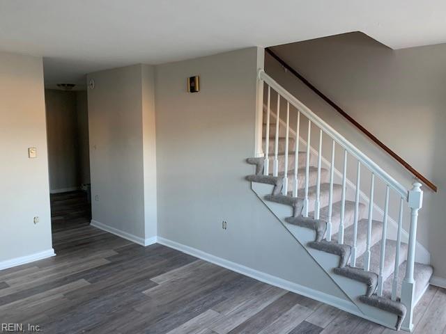 stairway featuring hardwood / wood-style floors