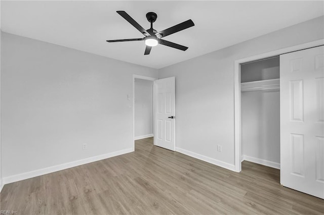 unfurnished bedroom with light wood-type flooring, a closet, and ceiling fan