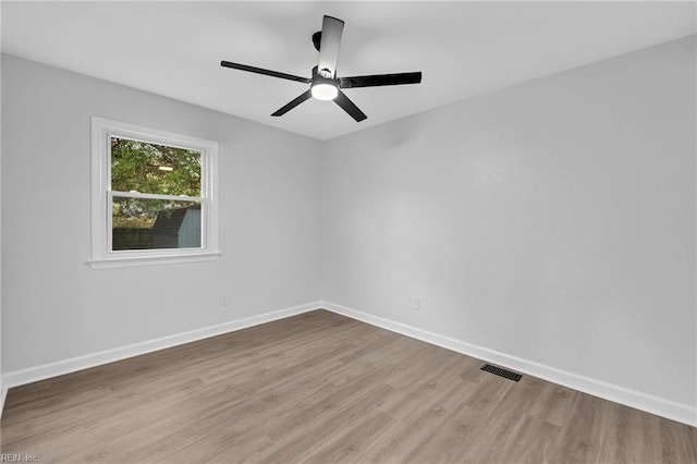 spare room featuring ceiling fan and hardwood / wood-style floors