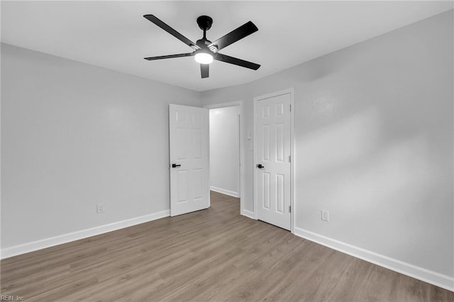 unfurnished bedroom featuring light wood-type flooring and ceiling fan