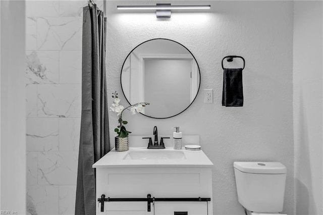 bathroom with vanity and toilet