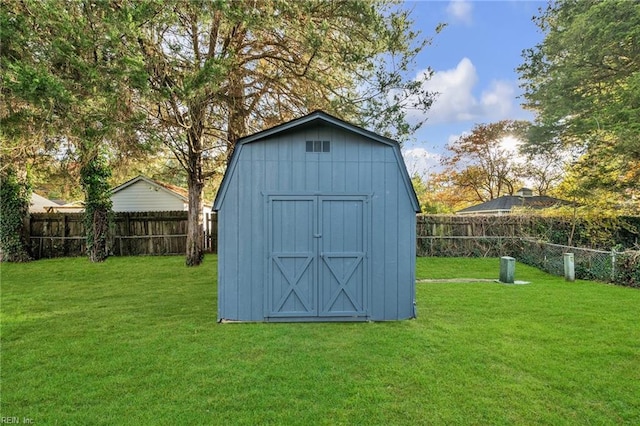 view of outdoor structure featuring a lawn