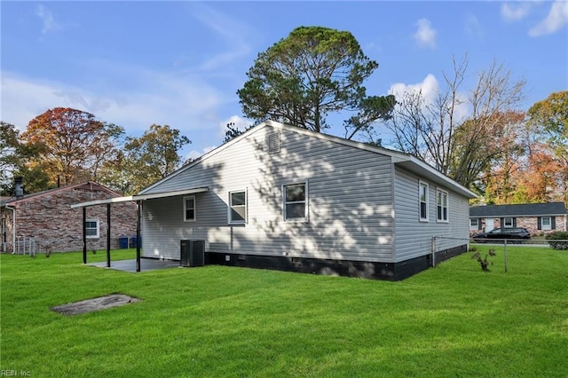 exterior space featuring central air condition unit, a yard, and a patio