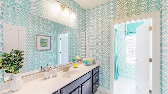 bathroom with tile patterned floors and vanity