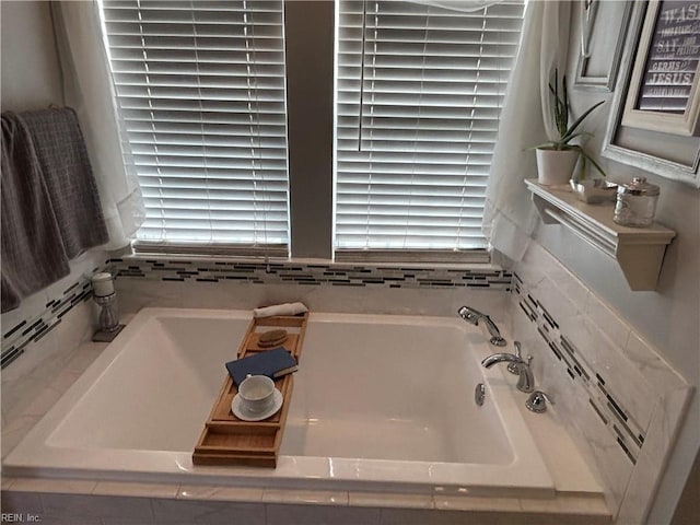 bathroom featuring a relaxing tiled tub