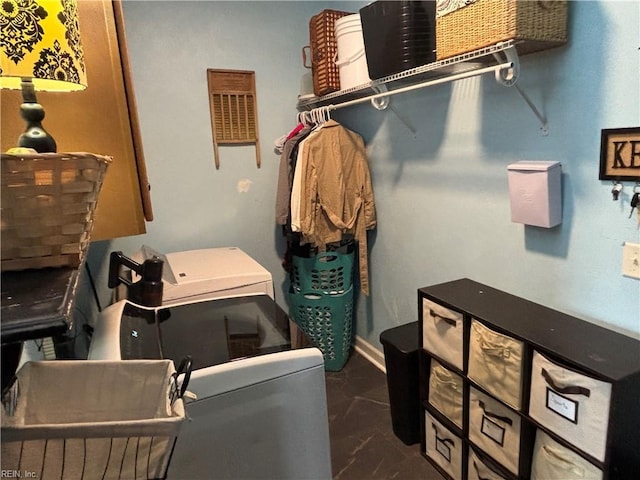 laundry area with washing machine and clothes dryer